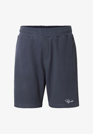 Marineblaue, gerippte Stoffshorts mit elastischem Bund, Seitentaschen und weißem "Pegador"-Schriftzug am Saum des linken Beins.