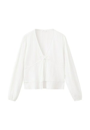 Blusa bianca cropped a maniche lunghe con scollo a V e dettaglio nodo frontale, realizzata in tessuto leggero e strutturato con polsini elasticizzati.