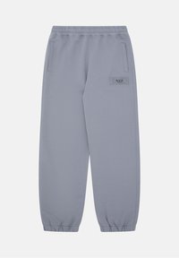 Grijze joggerbroek met een elastische tailleband, cuffs aan de enkels, zijzakken en een gemerkt label op het linkerbeen. Soepele stofstructuur.