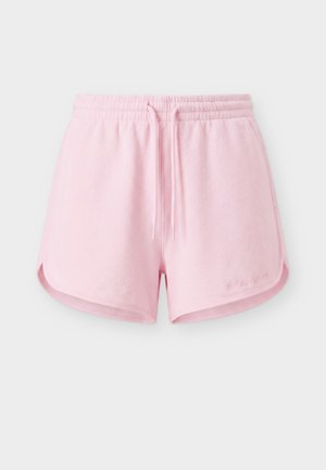 Lyserøde elastiske shorts med snøring i taljen, buede sidesømmer og diskret broderet mærkelogo på det nederste højre ben.