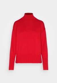 Pull en col roulé rouge en tricot côtelé, avec une coupe décontractée, des manches longues et un ourlet large côtelé.