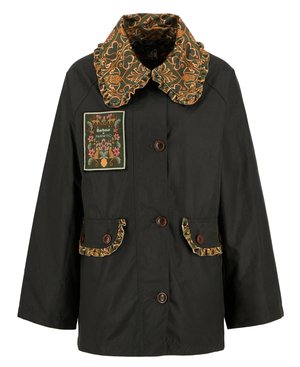 Black jacket with a patterned ruffled collar, decorative front patch, and two front pockets featuring matching accents and brown buttons.