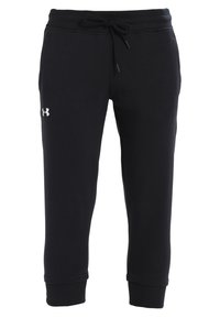 Svarta träningsbyxor i mjukt tyg, med en elastisk midja och dragsko samt en liten vit logotyp på vänster ben.