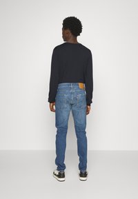 Levi's® 512™ SLIM TAPER - Džíny Slim Fit - blue denim
