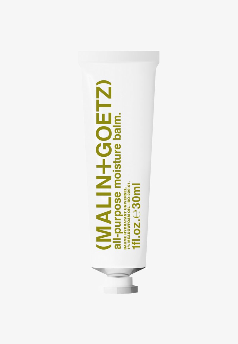 Tube de baume hydratant multi-usage Malin+Goetz avec texte vert sur un emballage blanc, 30 ml, bouchon en bas.