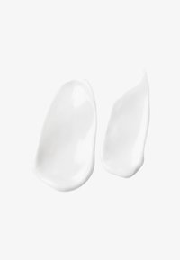Witte crème weergegeven in twee onregelmatige, gladde bolletjes met een glanzende afwerking op een neutrale achtergrond.