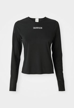 Zwarte mesh top met lange mouwen en ronde hals, met het witte "CALVIN KLEIN" logo in het midden van de borst.