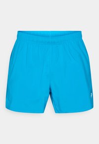 Μπλε αθλητικό σορτς με ελαστική μέση, λείο ύφασμα και πλαϊνές τσέπες. Διαθέτει μικρό λογότυπο στο κάτω δεξί μέρος.