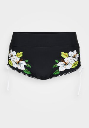 Black swim shorts with high waist, white and green hibiscus floral prints on sides, and white adjustable side ties with stitched edges.