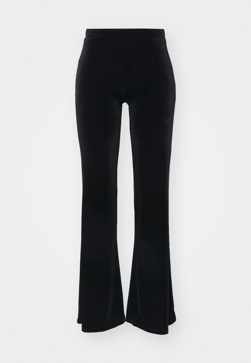 Pantalon noir en velours taille haute avec jambes évasées et silhouette ajustée, présenté sur un fond blanc.
