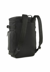 Sac à dos noir avec un panneau latéral en mesh texturé. Équipé de bretelles rembourrées ajustables et d'une poche zippée sur le côté. Design compact rectangulaire.