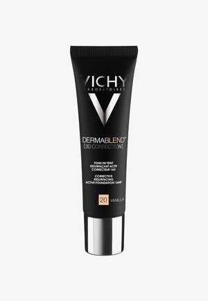 Black tube with glossy silver base and pump. Label features "VICHY," "DERMABLEND," and shade "20 VANILLA" in white and rose gold text.