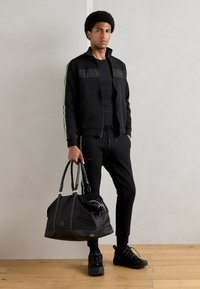Antony Morato TROUSERS METAL EFFECT RUBBER LOGO - Pantalon de survêtement - black