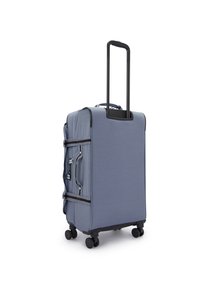Blue fabric suitcase with a telescoping handle, smooth wheels, and side pockets. Features a textured pattern and black accents. Compact design.