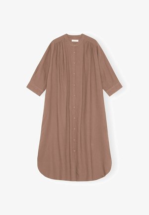 Brūna, garām piedurknēm kleita no mīkstas auduma, ar pogām priekšpusē, apaļu izgriezumu un savilkti elementi krūtīs un piedurknēs.