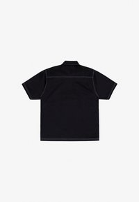 Black short-sleeve shirt with a collar, featuring contrasting white stitching along the seams and a relaxed fit design.