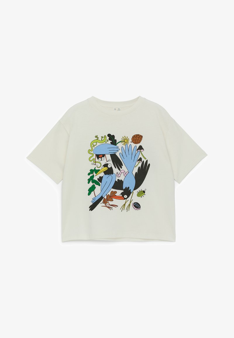 White short-sleeve t-shirt with colorful cartoon birds, leaves, a flower, a pine cone, a beetle, and a soda bottle cap graphic on front.