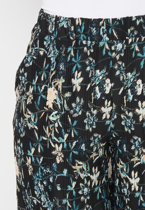 Tissu noir avec un motif floral en bleu canard et crème, présenté avec des plis et une taille élastique pour un ajustement confortable.