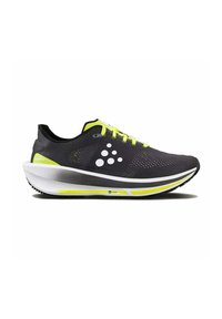 Baskets de course noires avec une tige en mesh respirant et des accents jaunes fluo. Dotées d'une semelle légère avec un design de talon profilé.