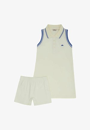 Vestito polo senza maniche color crema con rifiniture blu e pantaloncini elasticizzati in vita color crema abbinati, disposti in piano senza elementi di disturbo sullo sfondo.