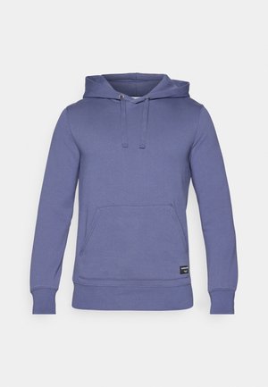 Mikina s kapucňou v jednofarebnej fialovej látke s vreckom typu kangaroo, sťahovacou šnúrkou a ribbed manžetami a dolným okrajom. Hladká textura.