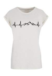 White short-sleeve T-shirt in soft fabric featuring a black mountain silhouette integrated with an ECG line across the chest.
