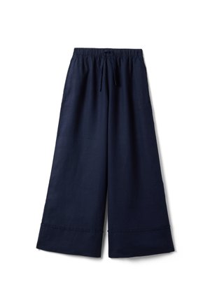 Pantalon large bleu marine avec taille élastique et cordon de serrage, doté d'ourlets larges et de poches latérales.