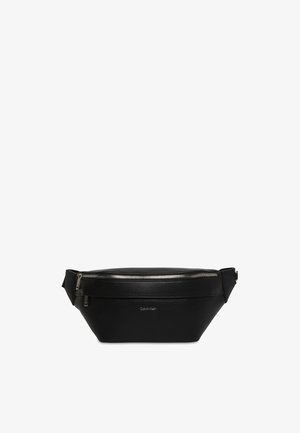 Black Calvin Klein leather waist bag with a top zipper and adjustable side straps.