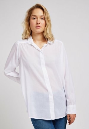 Camicia bianca a maniche lunghe con bottoni, realizzata in tessuto leggero, con colletto e polsini classici, dalla vestibilità comoda e una trama sottile.