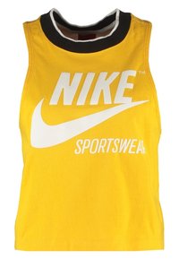 Žlutý bezrukávový crop top vyrobený z bavlny, s černobílým kulatým výstřihem a výrazným bílým logem Nike Sportswear vpředu.