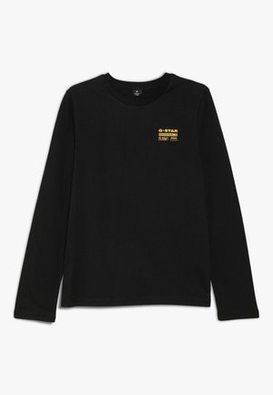 T-shirt noir à manches longues avec col rond et petit logo jaune "G-STAR ORIGINALS RAW DENIM" sur la poitrine gauche.