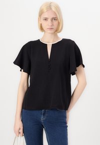 Black short-sleeve top with a keyhole neckline, featuring three buttons and a contrasting white trim along the neckline. Smooth textured fabric.