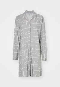 Sivo oblačilo s dolgimi rokavi, ki ima gumbasto sprednjo stran in bele abstraktne vzorce. Gladka tekstura, ovratnik in sproščen kroj.