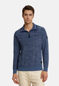 Marineblauer Pullover mit strukturiertem Stoff, Reißverschlusskragen und gestreiften Akzenten. Verfügt über eine Brusttasche sowie gerippte Bündchen und Saum.