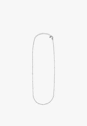 Ezüst lánc nyaklánc finom, apró, kerek gyöngyökkel díszített, amelyek egyenlő távolságra helyezkednek el a lánc mentén. Biztonságos kapoccsal rendelkezik a rögzítéshez.