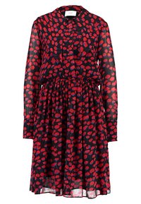 Sheer black dress with red and blue splatter print, a collared neck, long sleeves, and an elastic waistband for a gathered design.