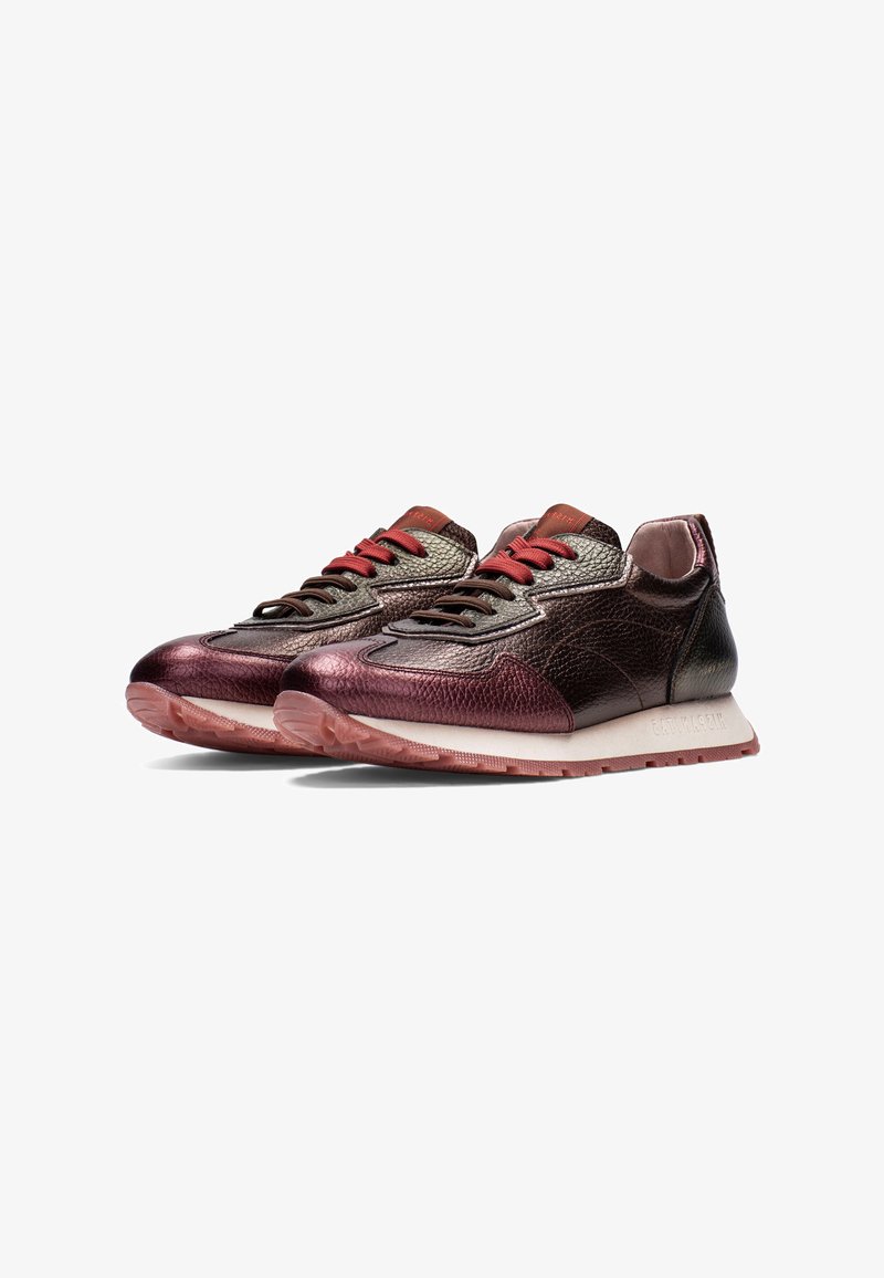 Metallic dark rose sneakers with textured leather, red laces, and a light-colored rubber sole. Features a smooth, curved silhouette.