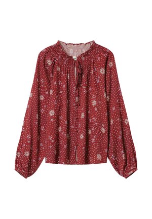 Blouse rouge à motif avec des manches longues, un col froncé et des détails floraux. Fabriquée en tissu léger avec une texture douce.