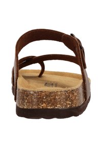 Ruskeat sandaalit, joissa on kaksi säädettävää hihnaa, korkkipohja ja teksturoitu pohja. Mukana kaareva pohja mukavuutta ja pitoa varten.