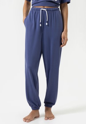 Marineblaue Sweatpants aus weichem Stoff, mit einem elastischen Bund und Kordelzug sowie elastischen Bündchen an den Knöcheln.