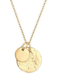 Collier en chaîne dorée arborant deux pendentifs circulaires : l'un est lisse et brillant, l'autre présente une texture avec une finition martelée.