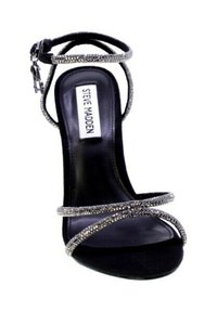 Sandal con tacco alto nero con molte cinghie glitterate e fibbia regolabile alla caviglia. Presenta un rivestimento interno liscio e una suola testurizzata.