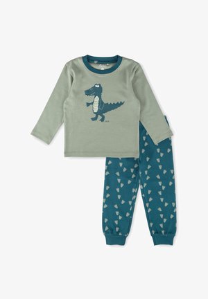 Children's two-piece pajama set with a green long-sleeve top featuring a crocodile graphic and blue pants with scattered light-colored footprints.