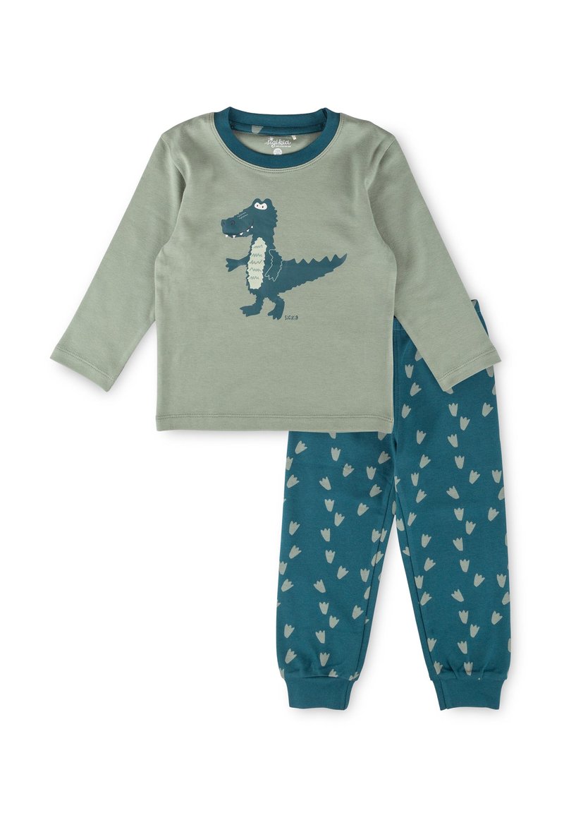 Children's two-piece pajama set with a green long-sleeve top featuring a crocodile graphic and blue pants with scattered light-colored footprints.
