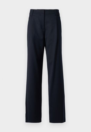 Mørkeblå skreddersydde bukser laget av teksturert stoff. Har litt utsvingte ben og flat midje med belteholdere.