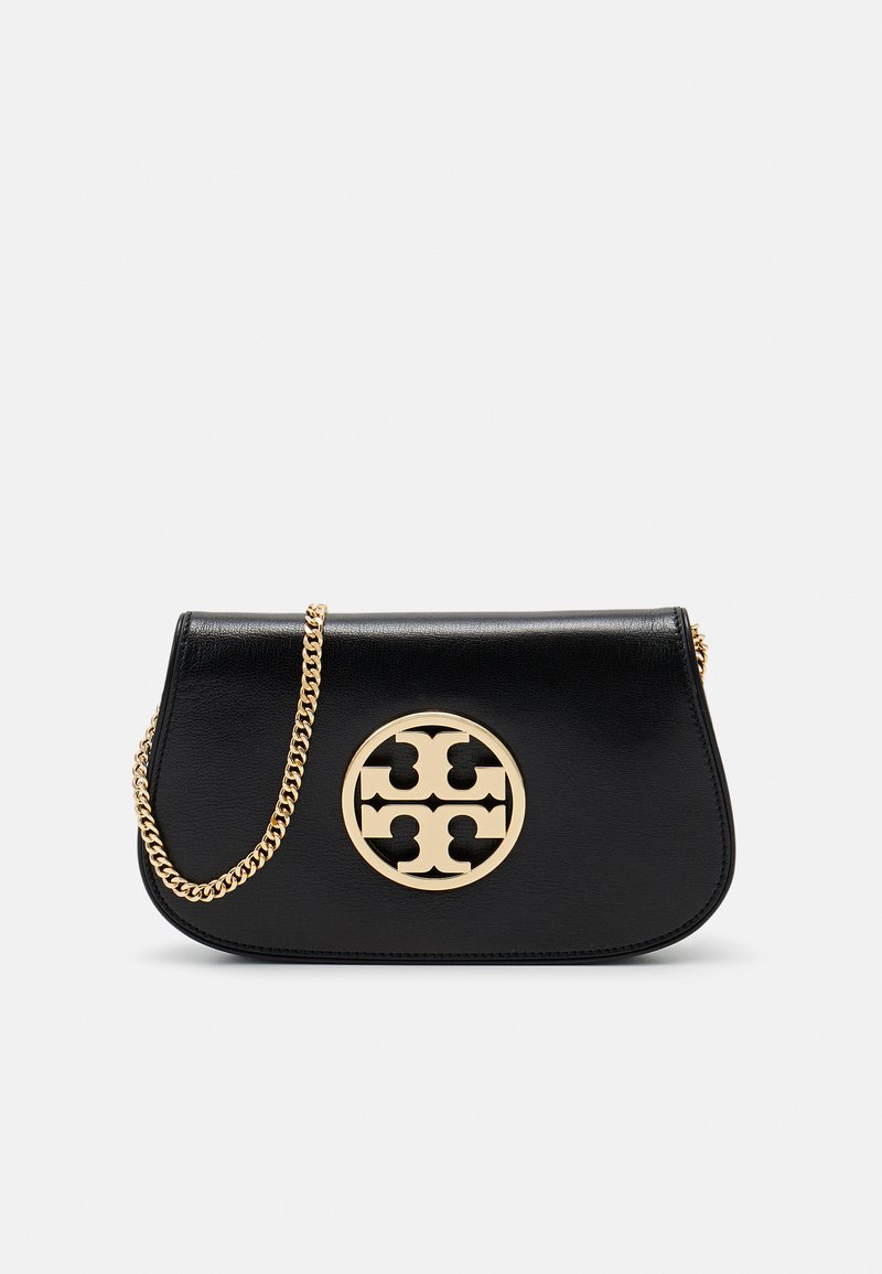 Black leather handbag with a curved design, featuring a gold circular logo and a gold chain strap. Smooth texture, minimalist style.