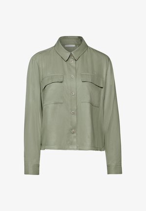 Světl zelená zkrácená košile na knoflíky s límečkem, dvěma náprsními kapsami a dlouhými rukávy. Vyrobena z hladkého, lehkého materiálu.
