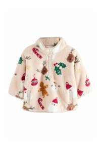 Puha világos rózsaszín fleece pulóver karácsonyi témájú mintákkal, például mézeskaláccsal, Mikulással, magyal ággal és díszekkel. Cipzáros nyakkal rendelkezik.