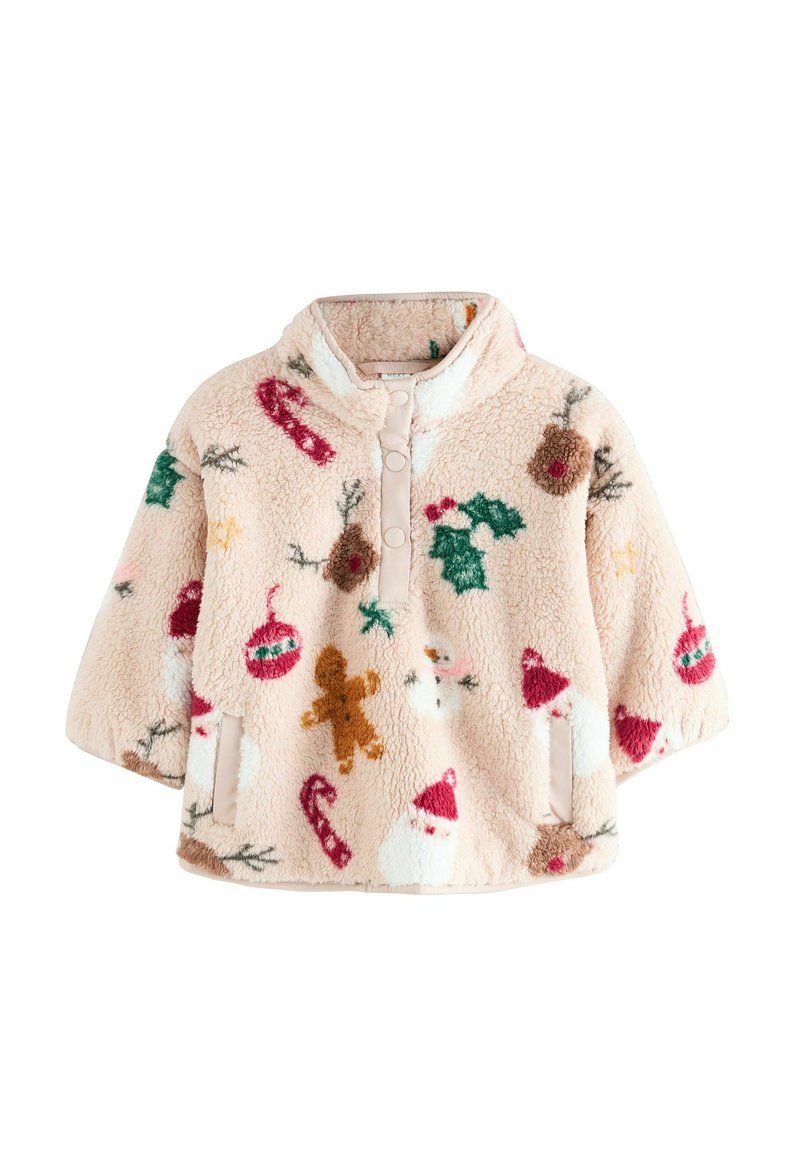 Puha világos rózsaszín fleece pulóver karácsonyi témájú mintákkal, például mézeskaláccsal, Mikulással, magyal ággal és díszekkel. Cipzáros nyakkal rendelkezik.