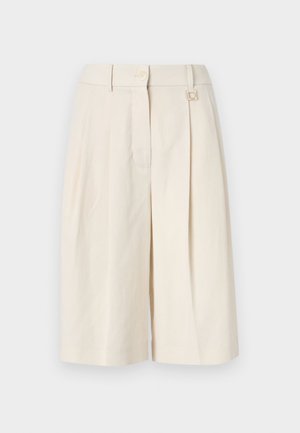 Beige tailored shorts in a pleated design, featuring a button closure and a metal accent. Made of lightweight fabric with a smooth texture.
